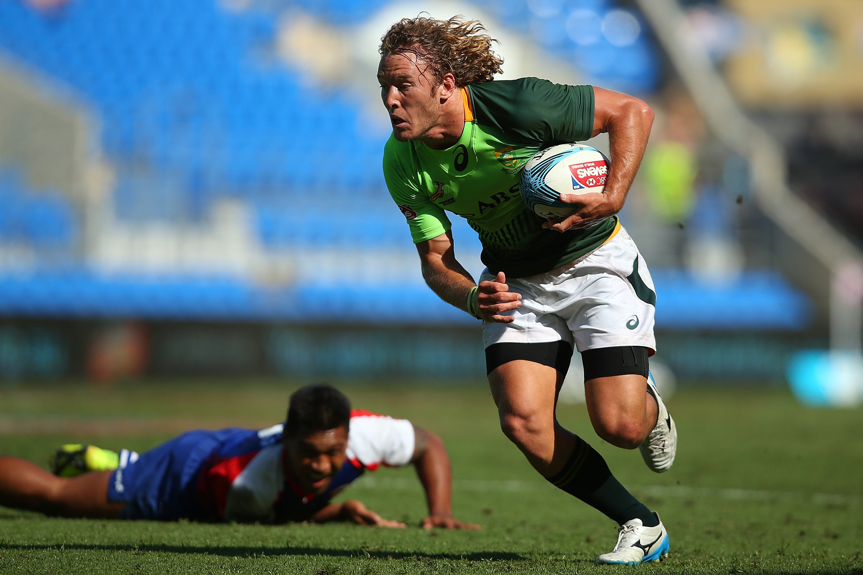 Werner Kok beating an opponent and running with the balll