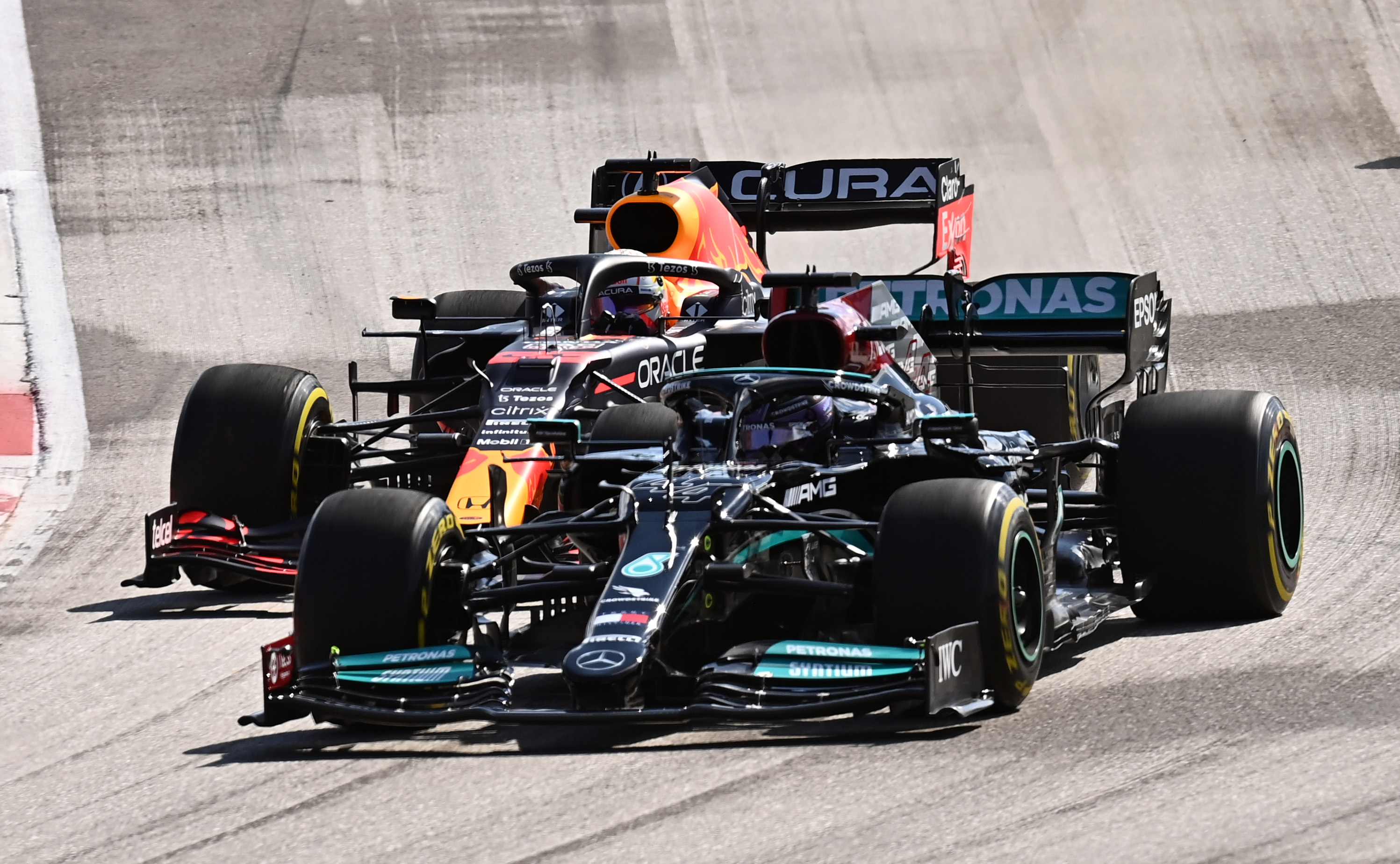 Mercedes and Red Bull F1 cars on track