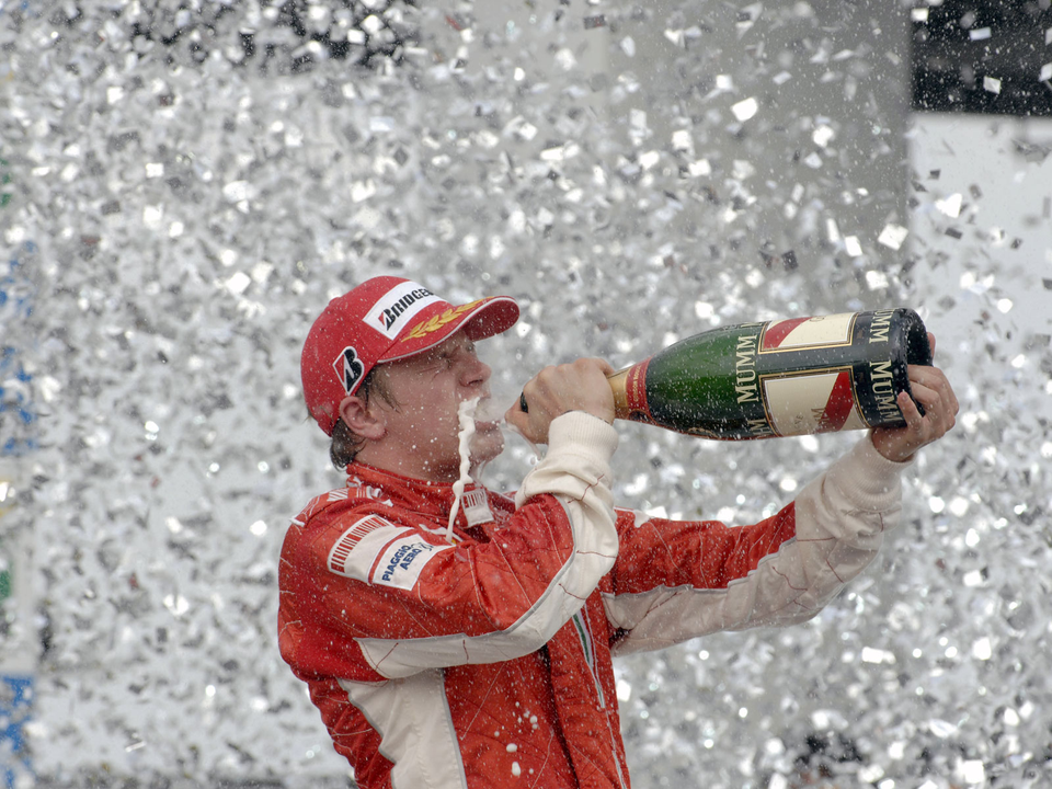 Kimi winning his World Drivers' Championship. On the podium taking a sip of Champaign..