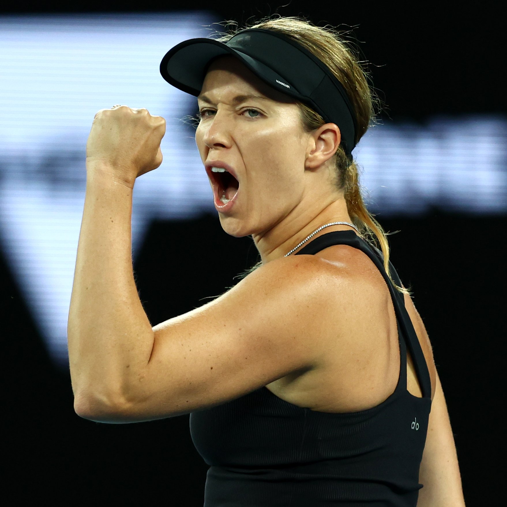 Danielle Collins punches the air celebrating a point at the 2022 Australian Open