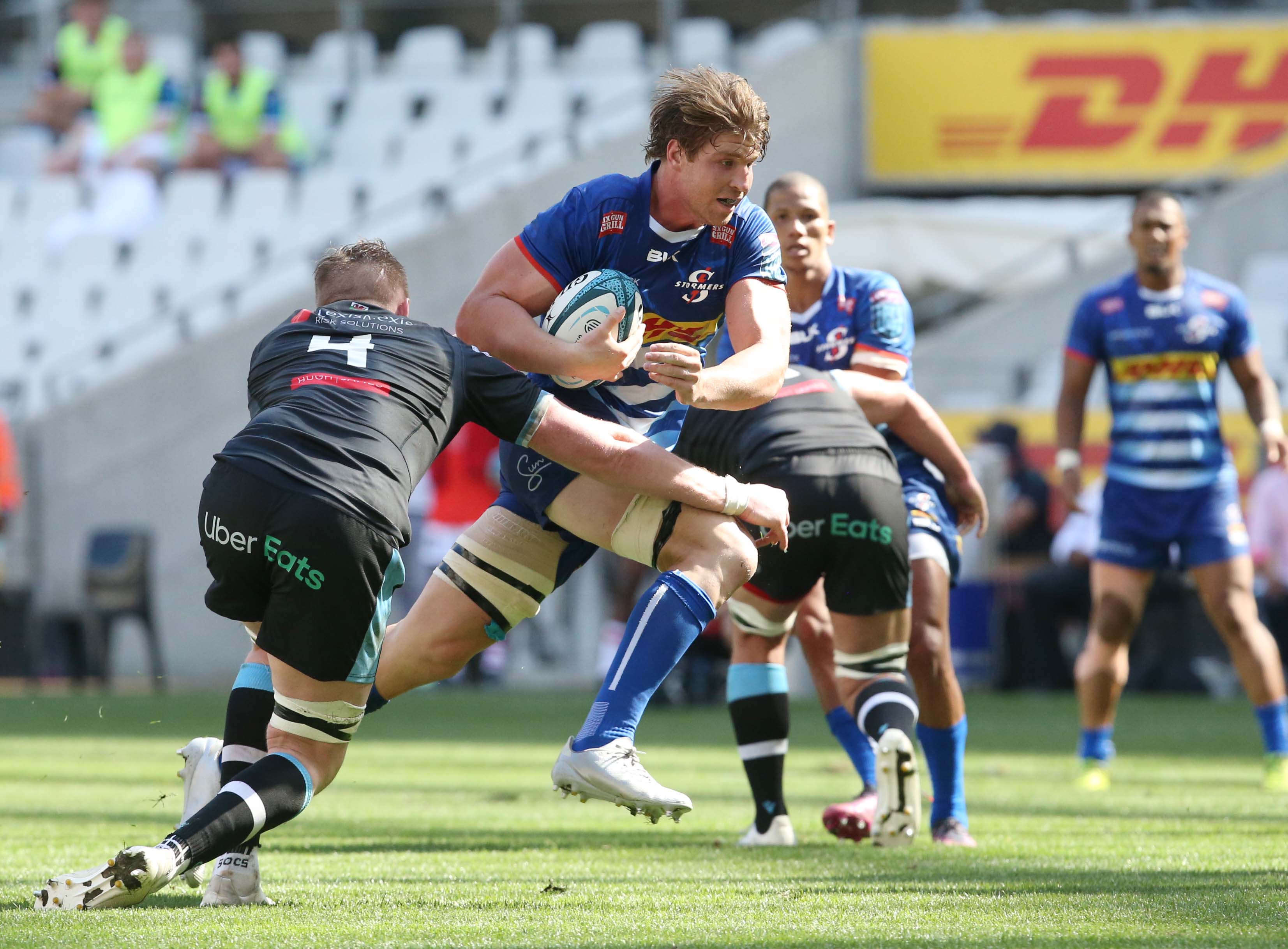 Stormers Evan Roos breaks a tackle against Cardiff