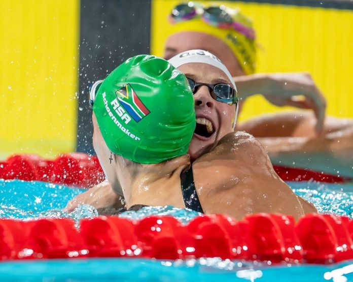 Tatjana Schoenmaker and Kaylene Corbett embrace after winning gold and bronze for team South Africa at the Commonwealth Games