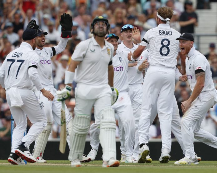 Dean Elgar walks off after losing his wicket, while England celebrate in the Proteas last test under coach Mark Boucher