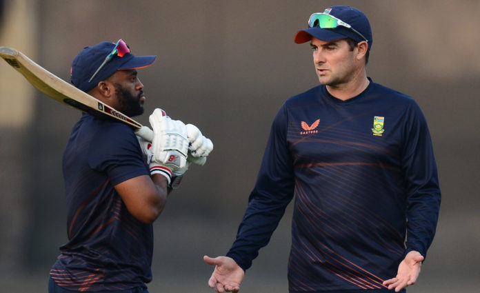 Proteas captain, Temba Bavuma and coach Mark Boucher in discussion at cricket training