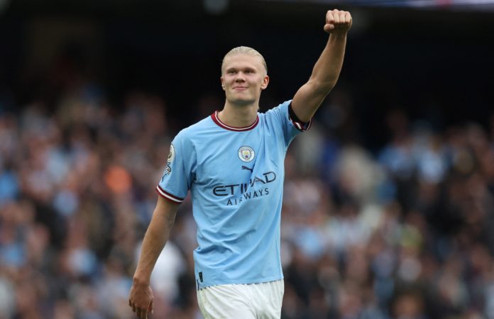 Erling Haaland raising his fist to the Manchester City fans