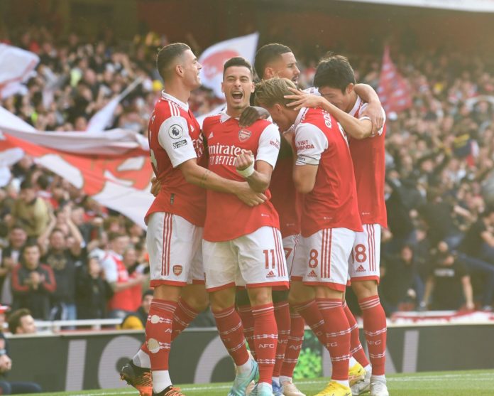 Martinelli, Xhaka, Odegaard, Tomiyasu and Saliba gather after an Arsenal goal