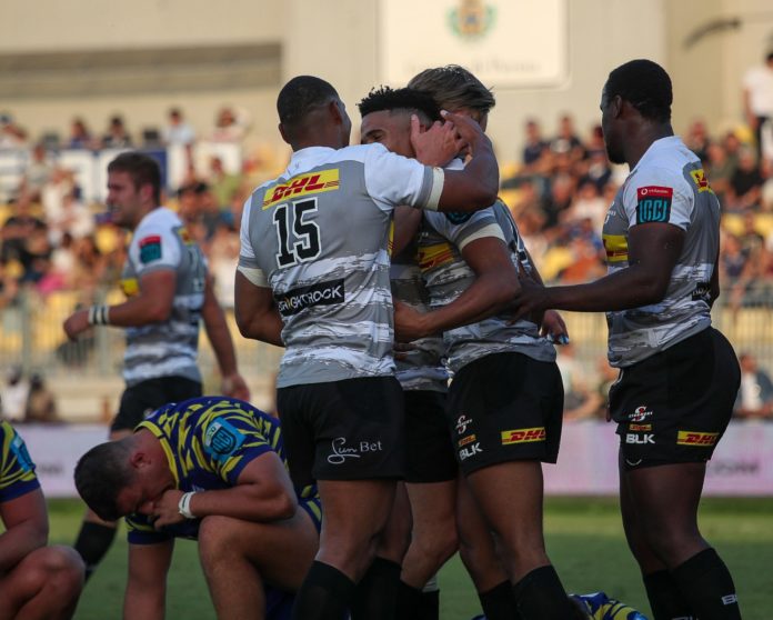 DHL Stormers players embrace Sasha Mgomezulu after scoring the bonus point try in their URC match agianst Zebre