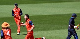 The Netherlands cricket team celebrate after taking a wicket in their ICC Men's T20 World Cup match against Scotland