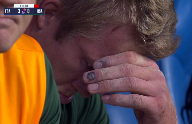 Springbok Pieter-Steph du Toit sits on the bench and cries after recieving a red card in the match against France.