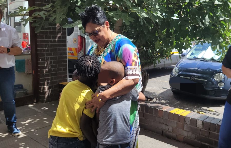 Woman hugging children