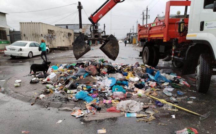 City at dump site in informal settlement camp