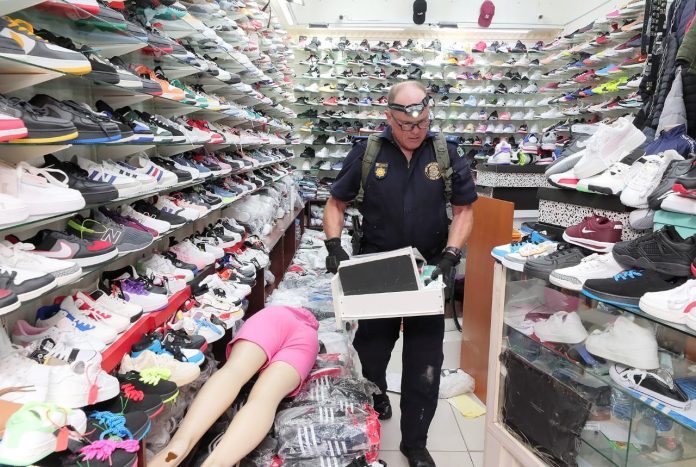 police officer inspecting counterfeit goods