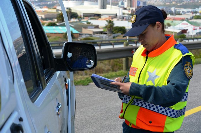 Western Cape traffic official issuing a fine