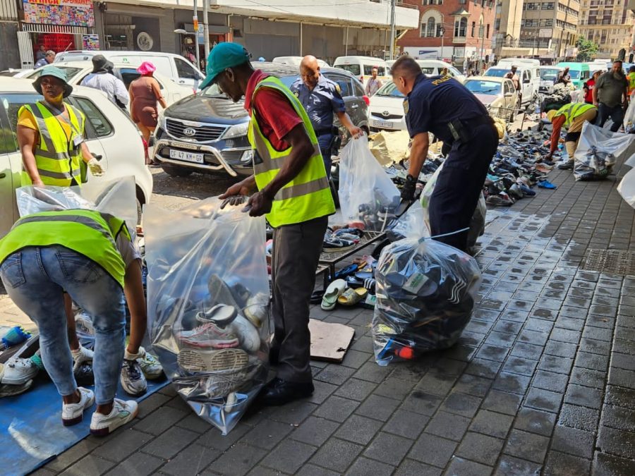 counterfeit goods put in bags on the sidewalk