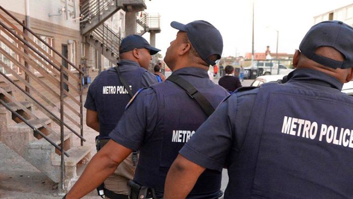 metro police officers conducting a search