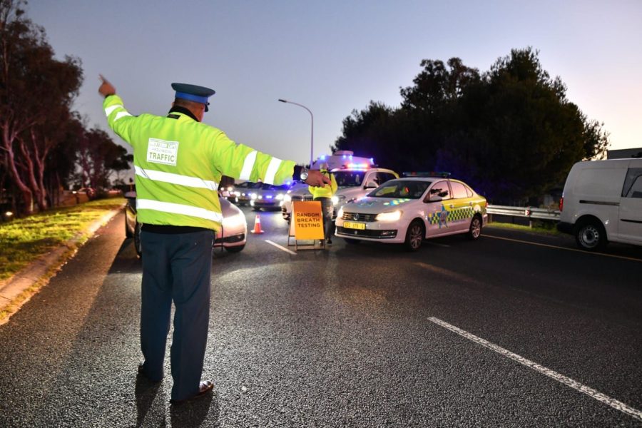 traffic officers directing motorists at night