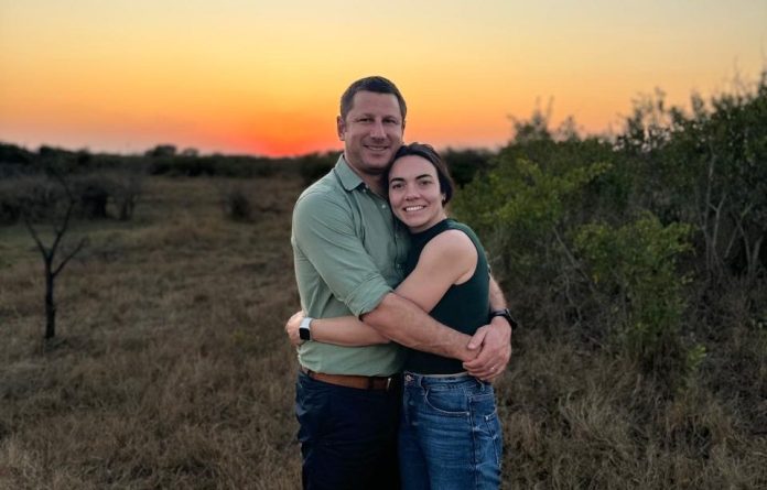 FC Conradie alongside his wife